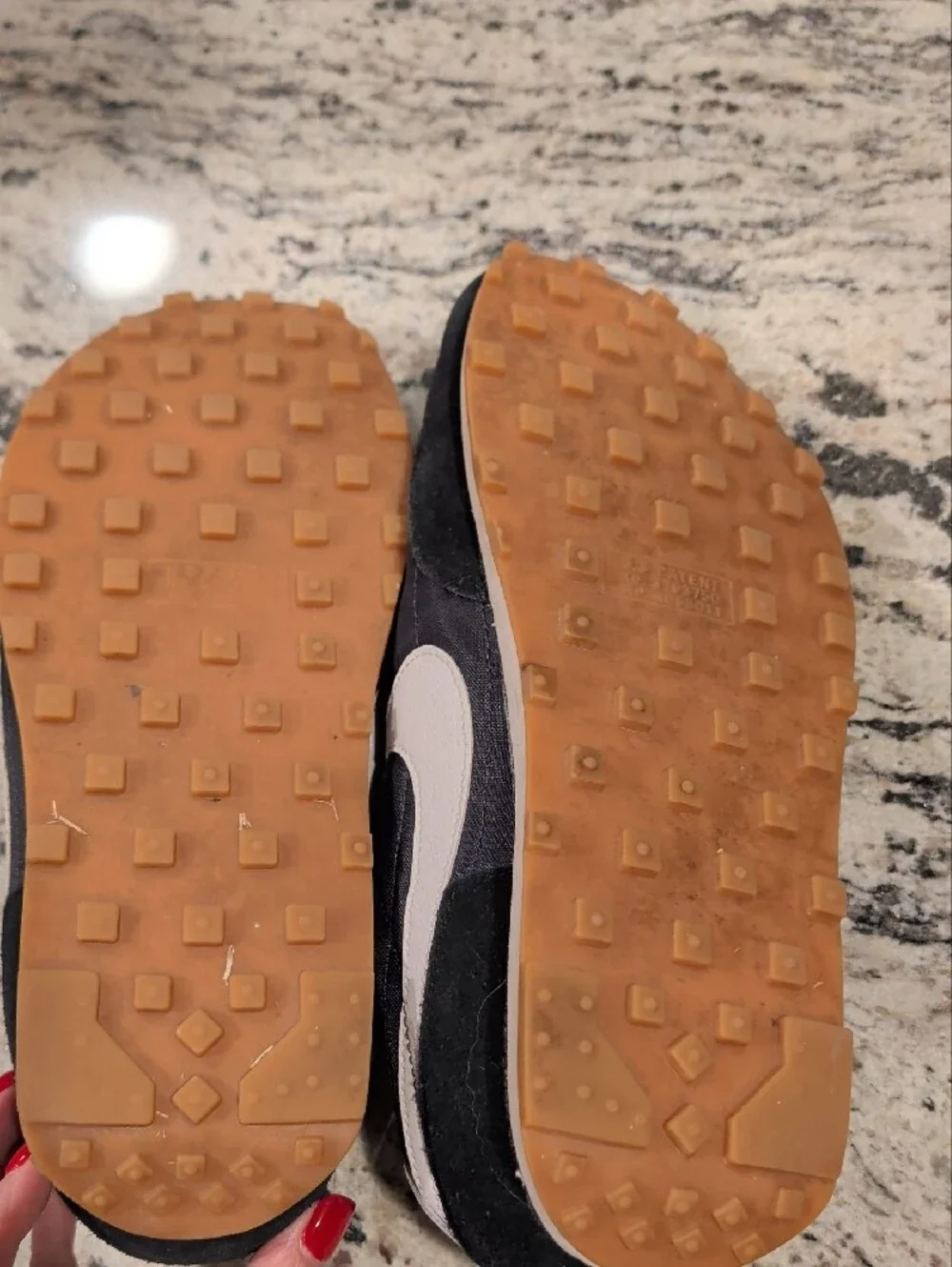 Nike Black Sneakers with White Swoosh and Orange Tongue Logo